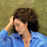 girl wearing repurposed designer vintage louis vuitton necklace