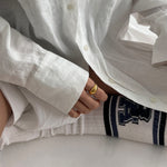 lifestyle photo of girl wearing 18ct gold dome ring, minimalist jewelry, hypoallergenic, safe for sensitive skin