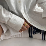 lifestyle photo of girl wearing 18ct gold dome ring, minimalist jewelry, hypoallergenic, safe for sensitive skin