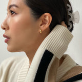 girl wearing 18ct gold vermeil micro hoop earrings
